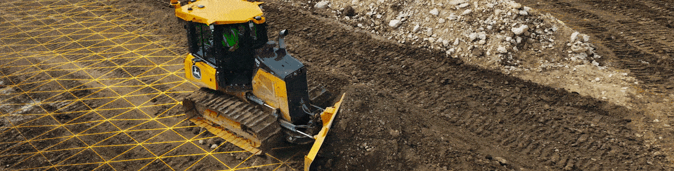 Una retroexcavadora con una cuadrícula amarilla superpuesta en el suelo, trabajando en un sitio de construcción.