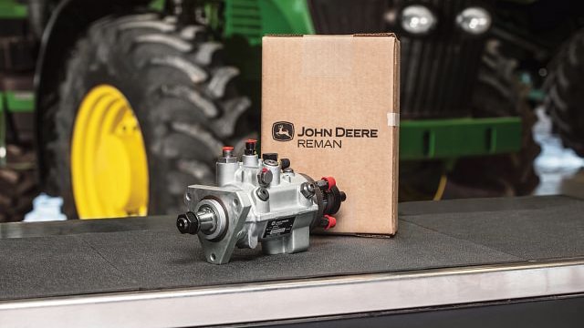 a Deere parts box with a remanufactured part next to it